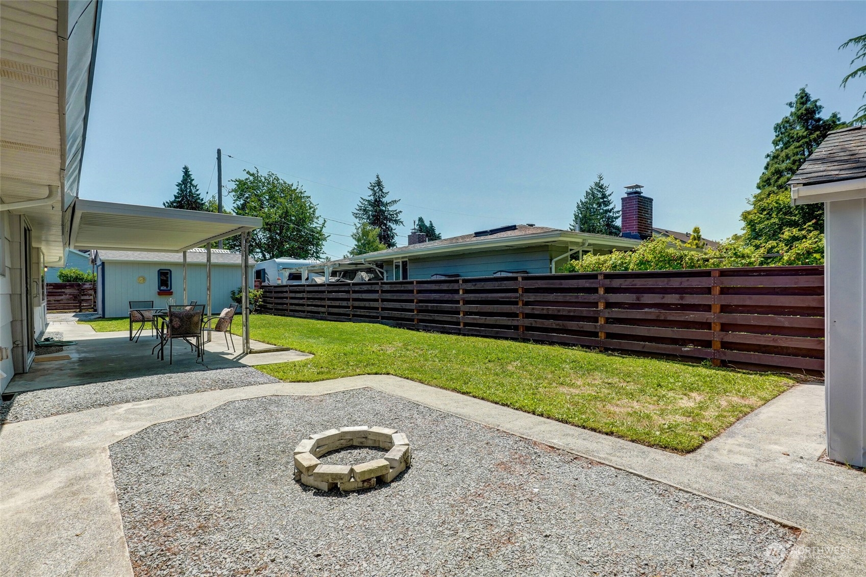 2309 Edmonds Avenue Northeast Renton, WA 98056 - Photo 26 of 35 a view of a backyard with plants and patio