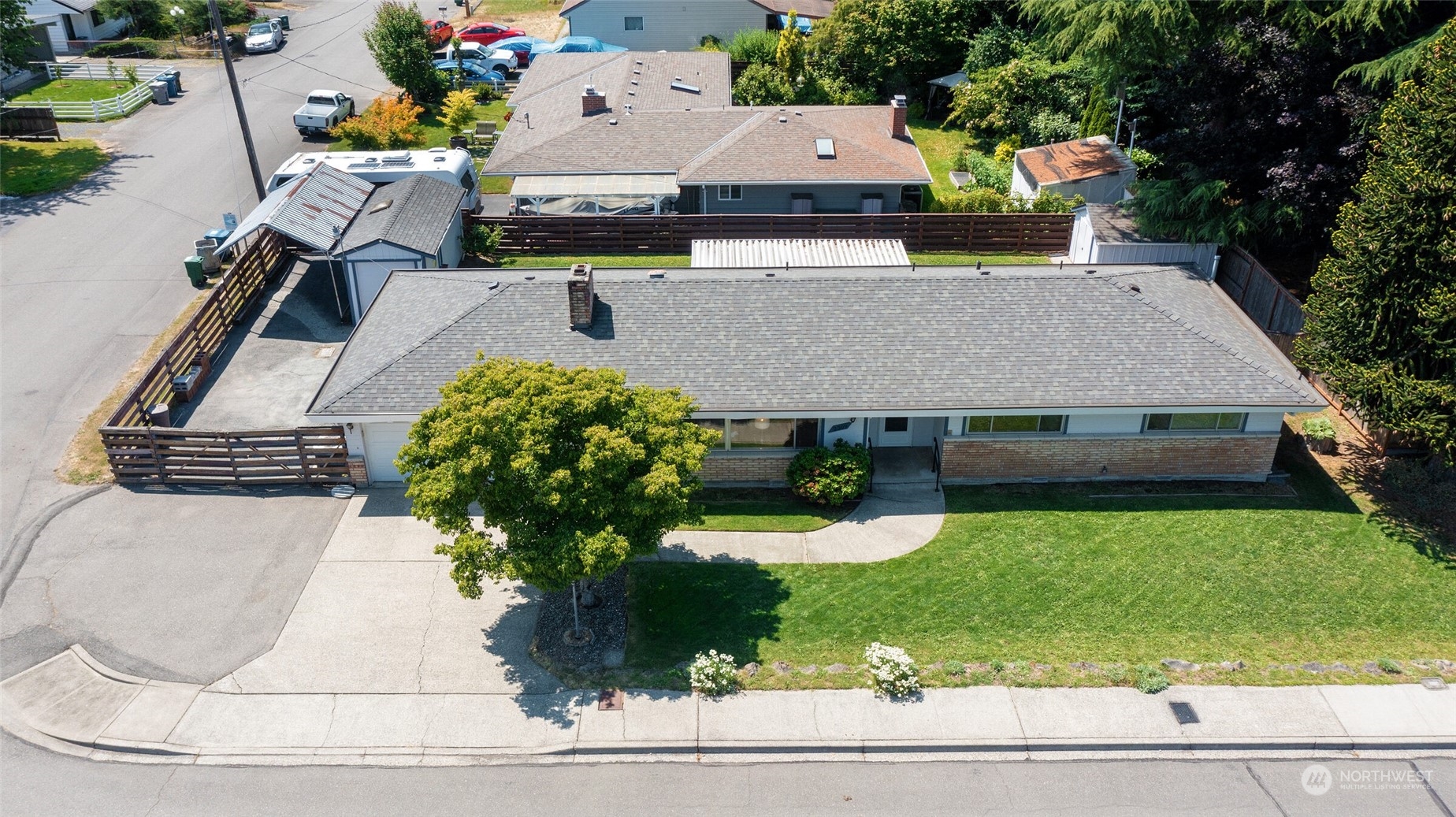 2309 Edmonds Avenue Northeast Renton, WA 98056 - Photo 28 of 35 an aerial view of a house with garden space and street view