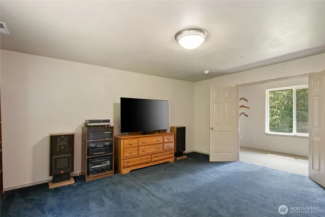 a bathroom with a bathtub a sink and a window