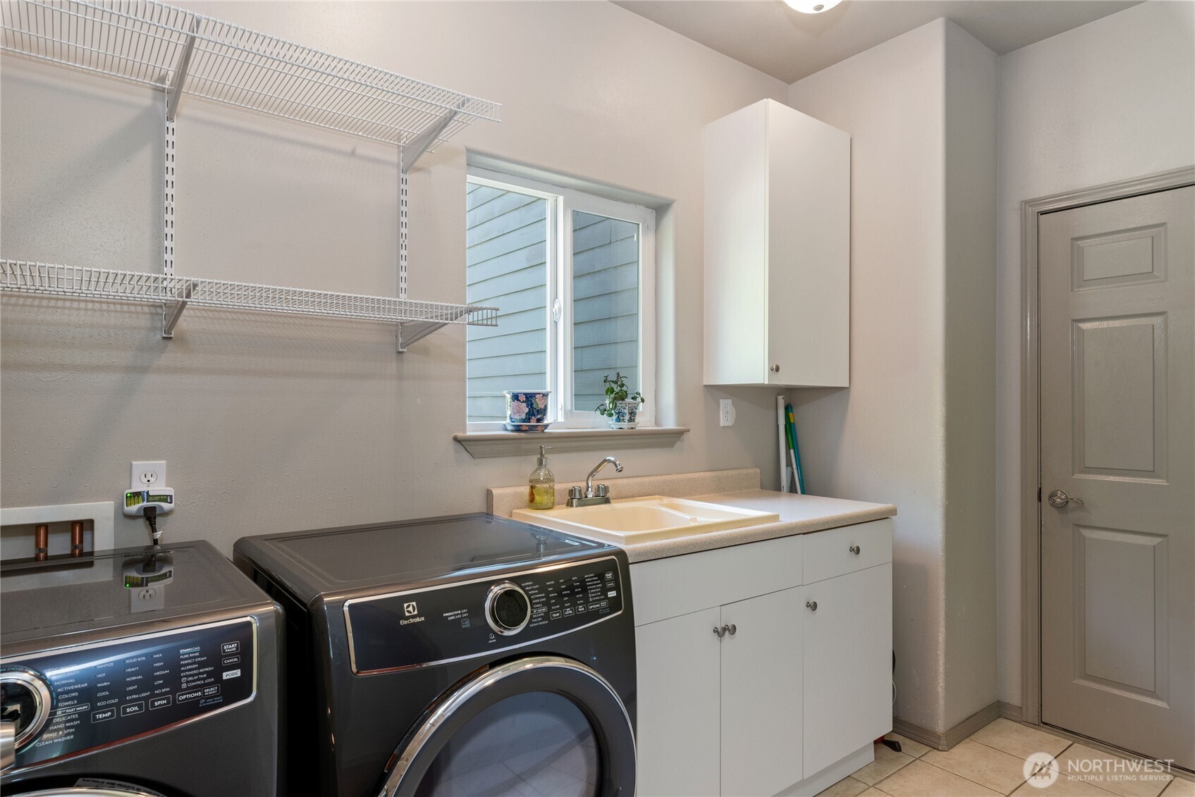 323 East Alderwood Road Belfair, WA 98528 - Photo 35 of 39 a utility room with a sink a washer and dryer