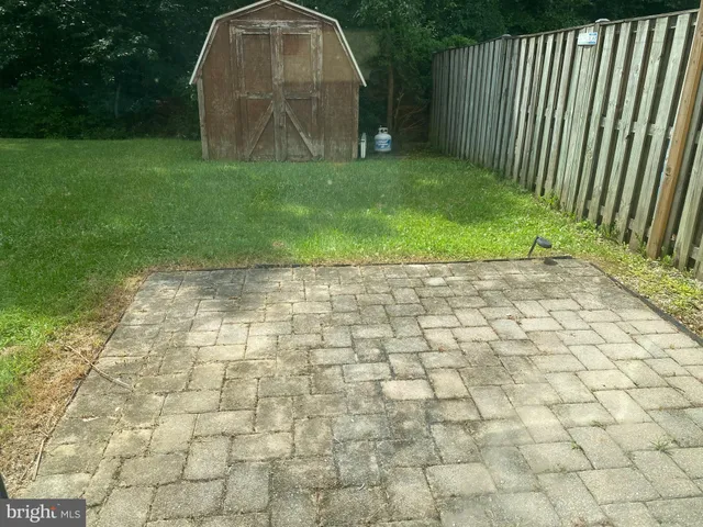 a view of a house with a yard and plants