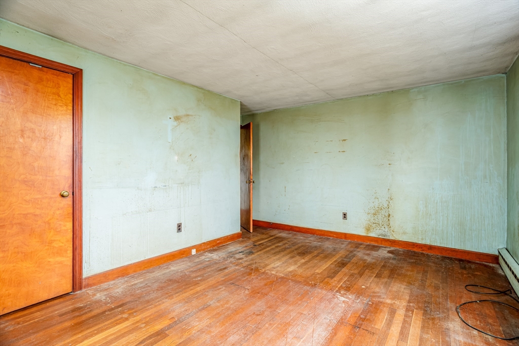 49 Bennett Street Chicopee, MA 01013 - Photo 11 of 42 an empty room with wooden floor