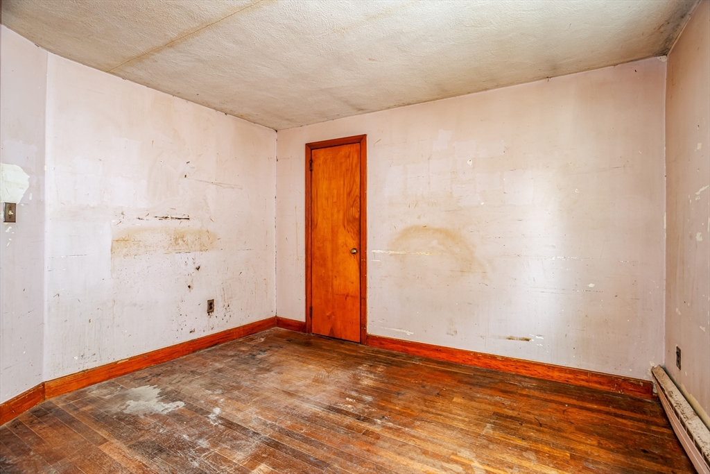 49 Bennett Street Chicopee, MA 01013 - Photo 18 of 42 a view of room with wooden floor
