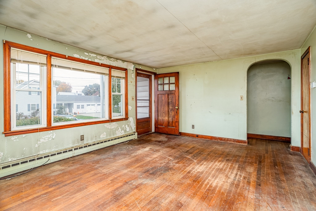 49 Bennett Street Chicopee, MA 01013 - Photo 3 of 42 a view of an empty room with a window