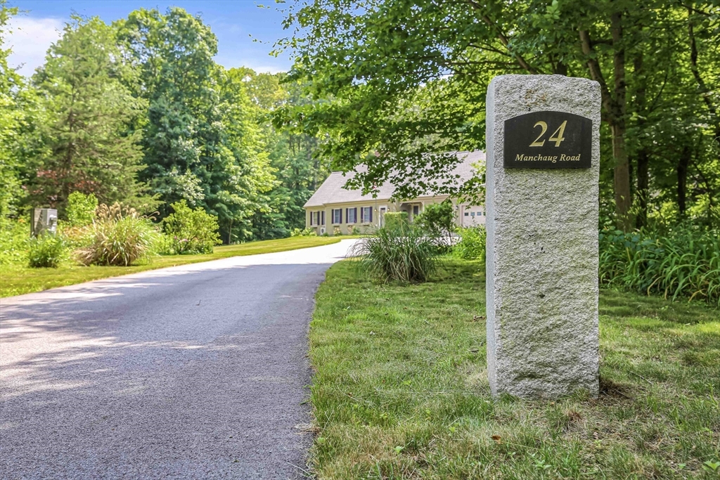 24 Manchaug Road Sutton, MA 01590 - Photo 2 of 40 a view of a pathway both side of building