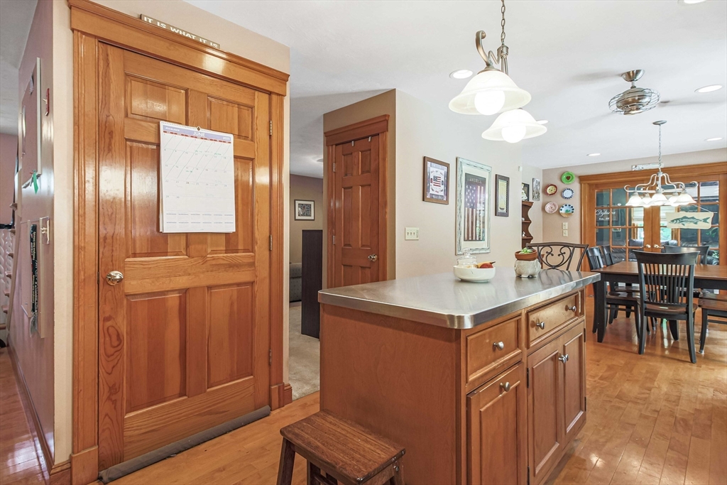 24 Manchaug Road Sutton, MA 01590 - Photo 21 of 40 a kitchen that has a lot of cabinets and wooden floor