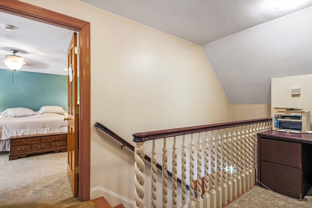 24 Manchaug Road Sutton, MA 01590 - Photo 24 of 40 a bedroom with a bed and a window