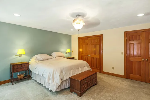 a bathroom with a sink mirror and vanity