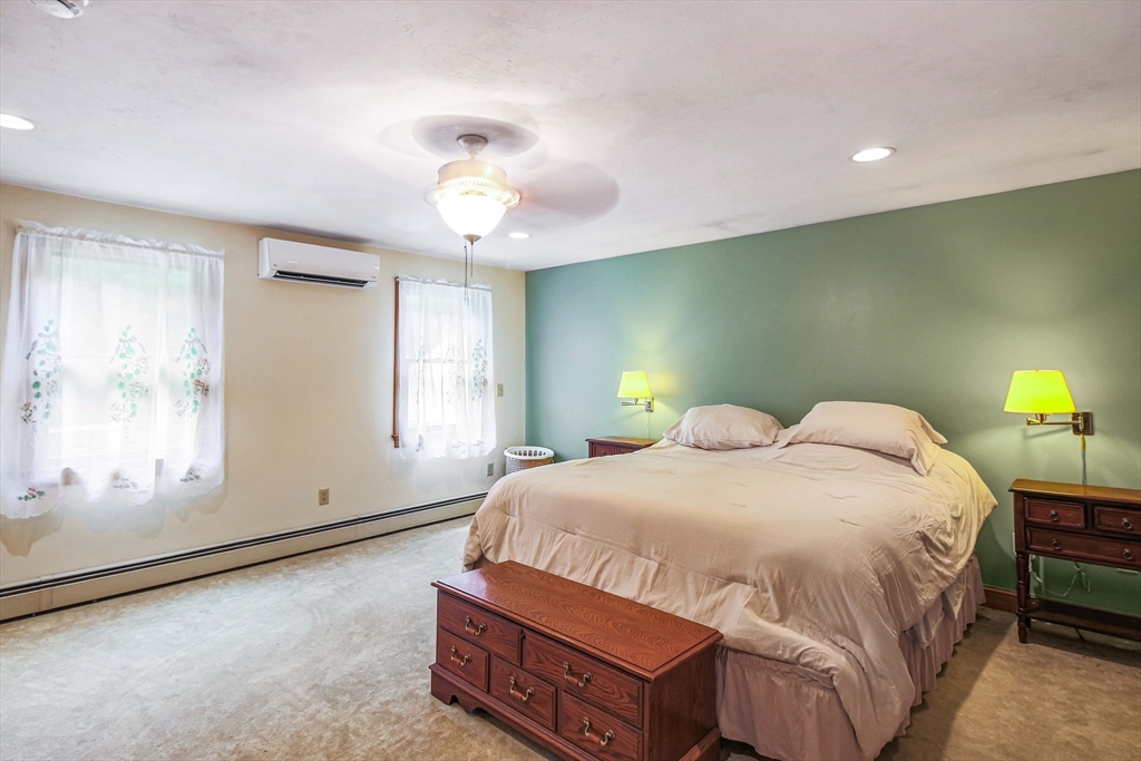 24 Manchaug Road Sutton, MA 01590 - Photo 27 of 40 a bedroom with a bed and a window