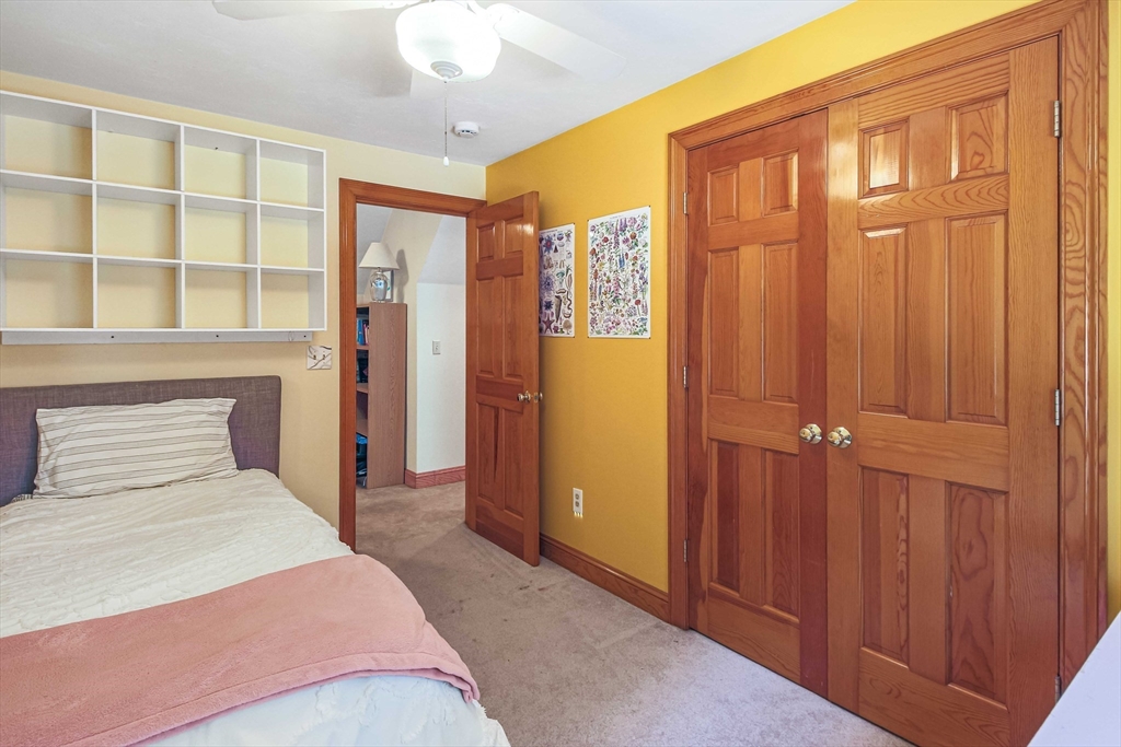 24 Manchaug Road Sutton, MA 01590 - Photo 31 of 40 a bedroom with a bed and a window