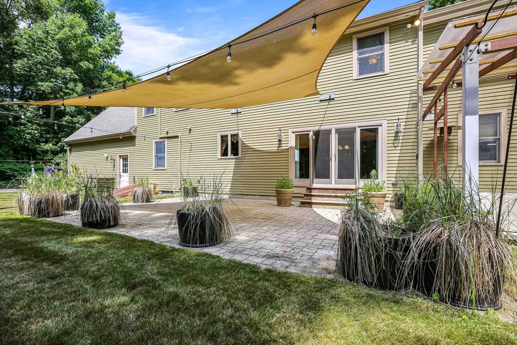 24 Manchaug Road Sutton, MA 01590 - Photo 5 of 40 a view of a house with backyard and sitting area