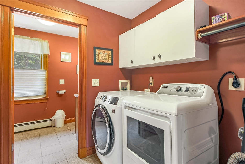 24 Manchaug Road Sutton, MA 01590 - Photo 9 of 40 a utility room with dryer and washer