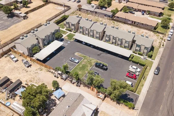 an aerial view of a house with outdoor space