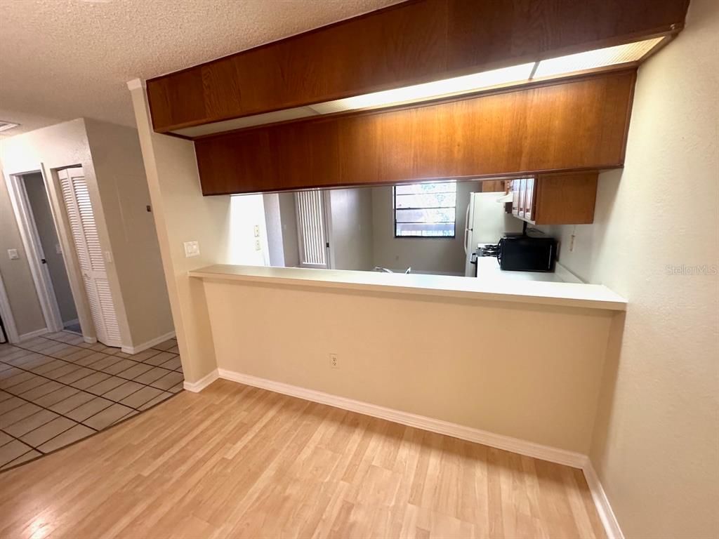 40 Austin Place Oldsmar, FL 34677 - Photo 22 of 26 a view of a room with wooden floor and chair