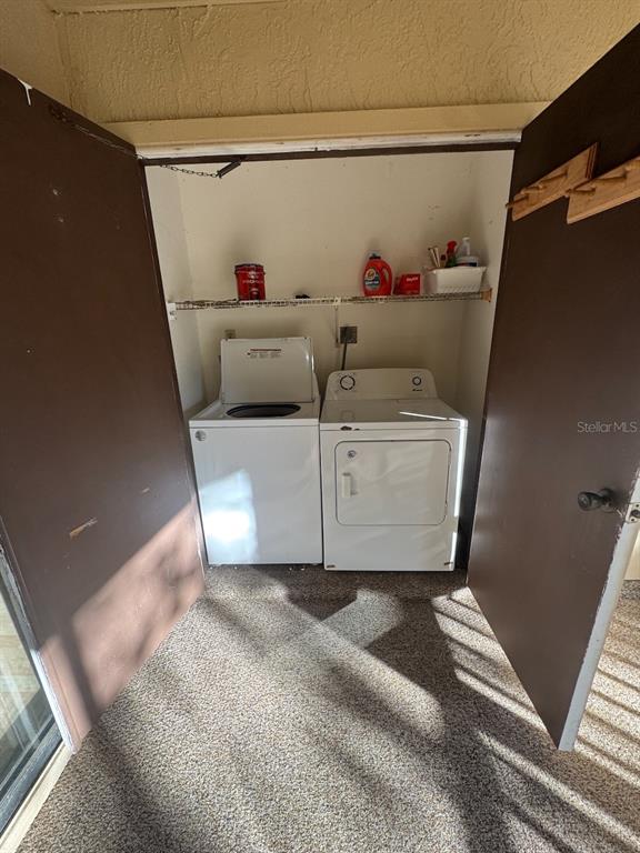 40 Austin Place Oldsmar, FL 34677 - Photo 25 of 26 a utility room with dryer and washer