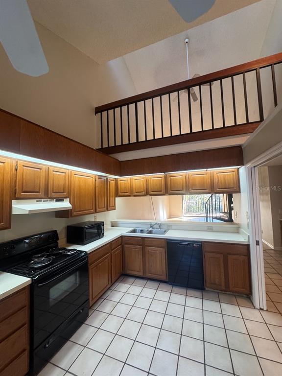 40 Austin Place Oldsmar, FL 34677 - Photo 5 of 26 a kitchen with granite countertop a sink and cabinets