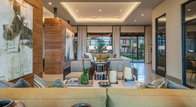 a lobby with furniture and window