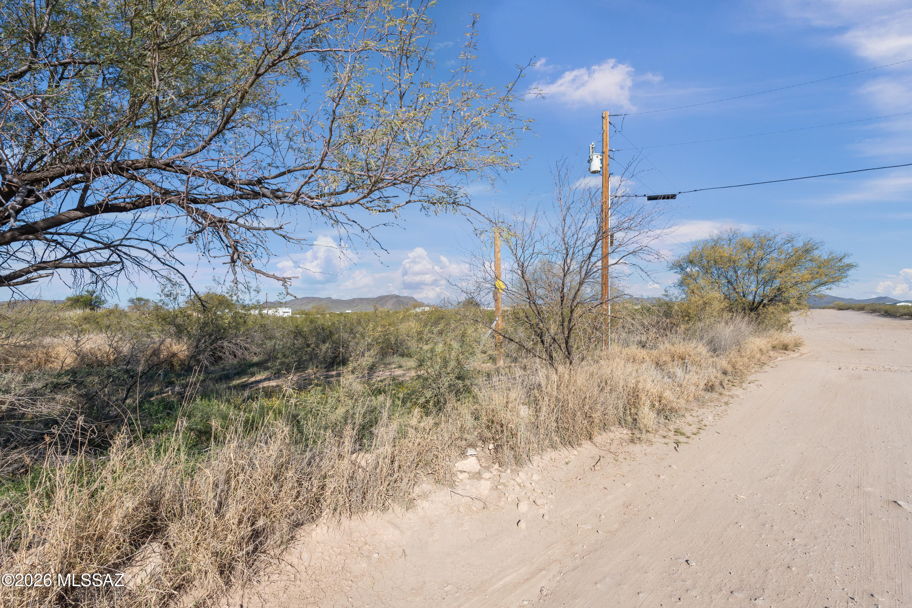 8890 South Fuller Road Tucson, AZ 85735 - Photo 11 of 12 a view of a house with a yard