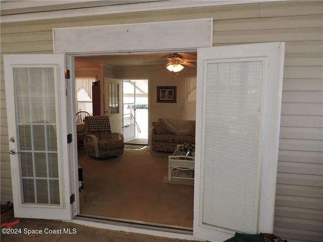 a view of a livingroom with furniture and windows