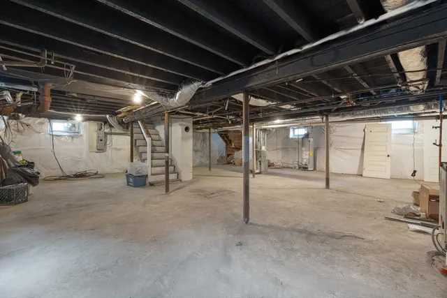 a view of empty room with wooden walls