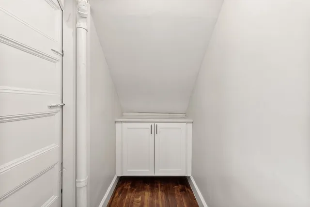 a view of a room with white walls