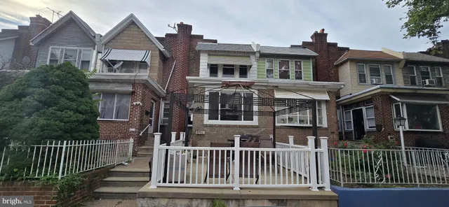 a front view of a house with a porch