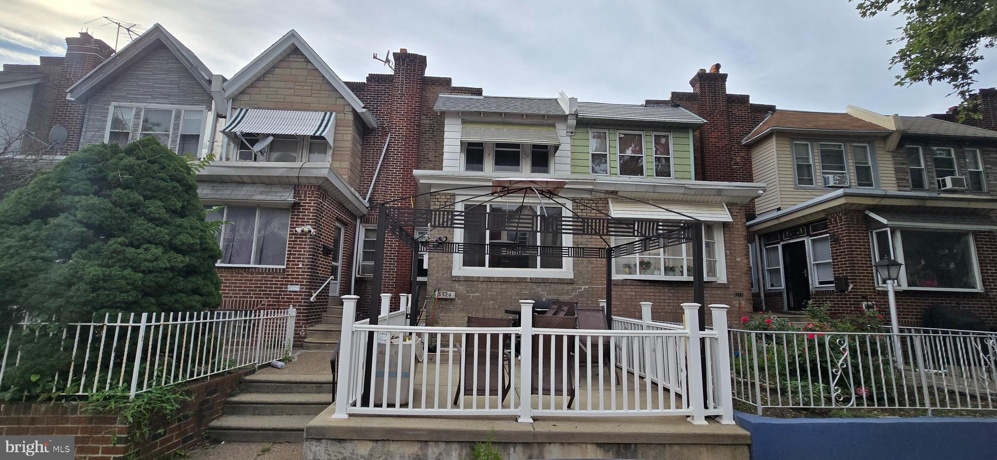 5520 Miriam Road Philadelphia, PA 19124 - Photo 1 of 3 a front view of a house with a porch