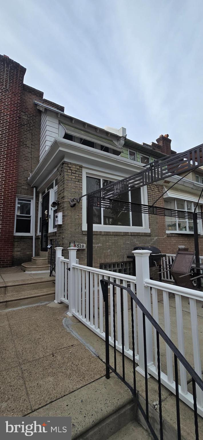 5520 Miriam Road Philadelphia, PA 19124 - Photo 2 of 3 front view of a house with a fence