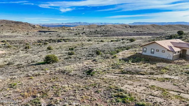 a view of a large building with a mountain in the background