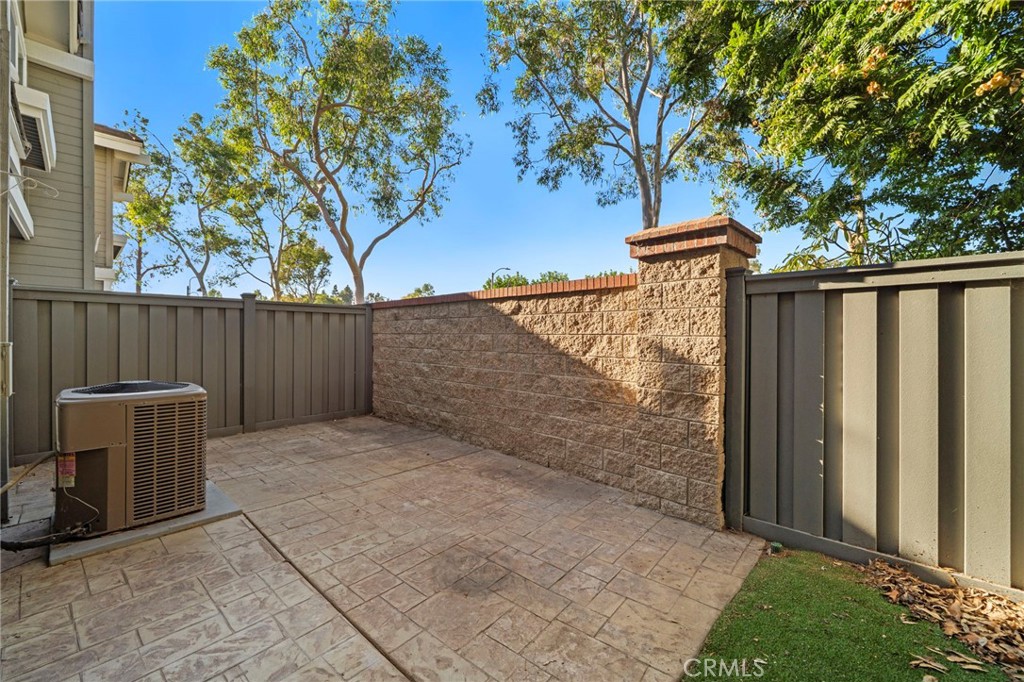13615 Almond Street Tustin, CA 92782 - Photo 25 of 54 a view of backyard with wooden fence and large trees