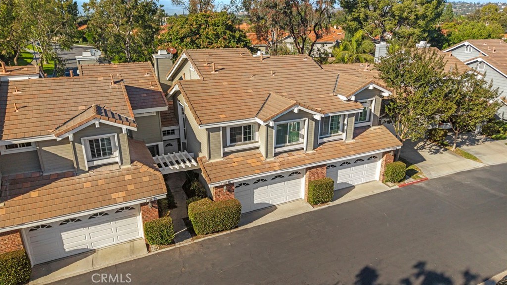 13615 Almond Street Tustin, CA 92782 - Photo 30 of 54 an aerial view of residential houses with street