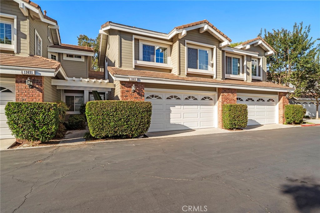 13615 Almond Street Tustin, CA 92782 - Photo 3 of 54 front view of a house with a street