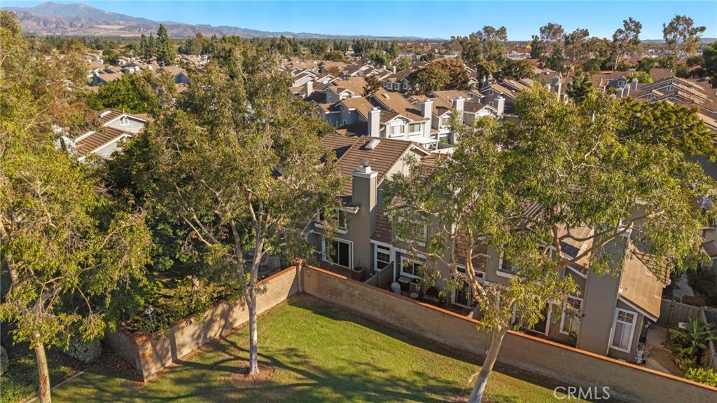 13615 Almond Street Tustin, CA 92782 - Photo 37 of 54 a view of a yard with a tree
