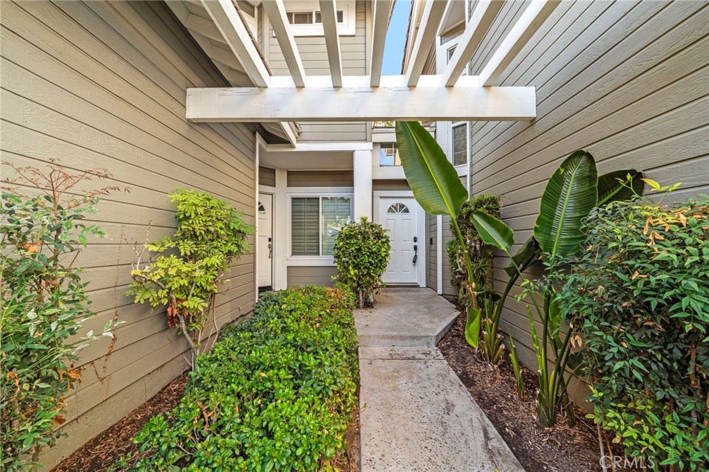 13615 Almond Street Tustin, CA 92782 - Photo 4 of 54 a front view of a house with a yard