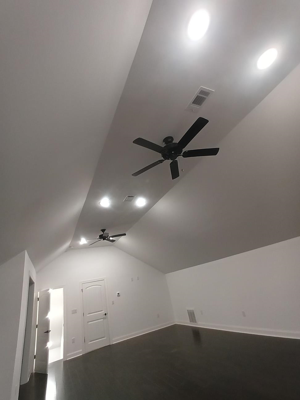 5690 Walnut Grove Road Memphis, TN 38120 - Photo 18 of 40 an empty room with a ceiling fan and window