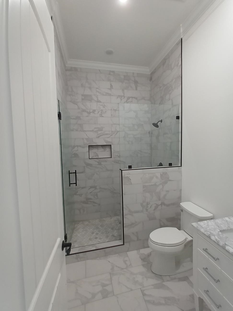 5690 Walnut Grove Road Memphis, TN 38120 - Photo 19 of 40 a bathroom with a toilet and a shower