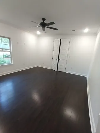 a bathroom with a toilet and a bathtub