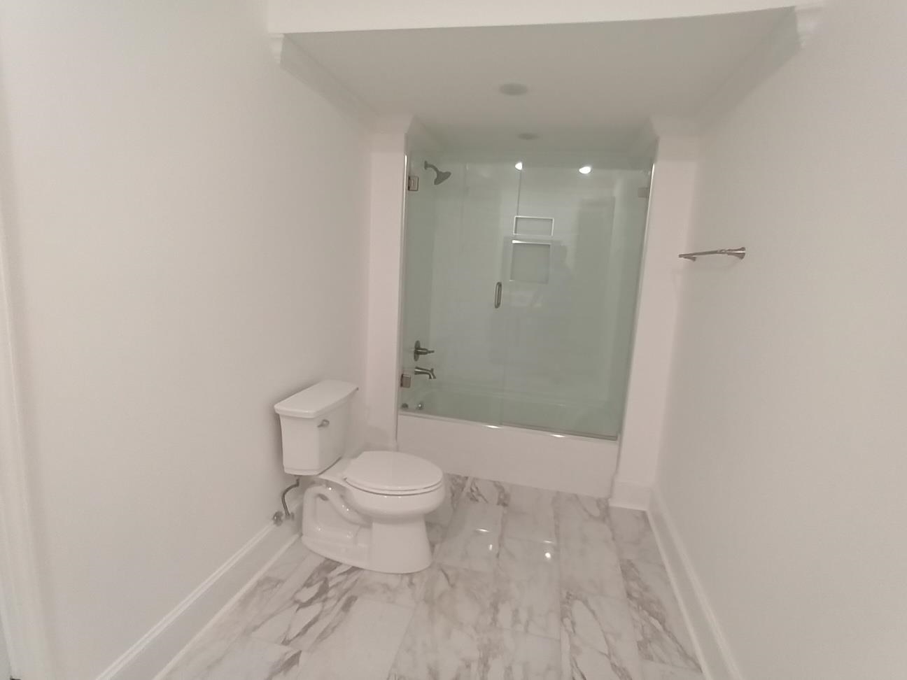 5690 Walnut Grove Road Memphis, TN 38120 - Photo 32 of 40 a bathroom with a toilet a sink and shower
