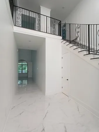 a view of a hallway with entryway