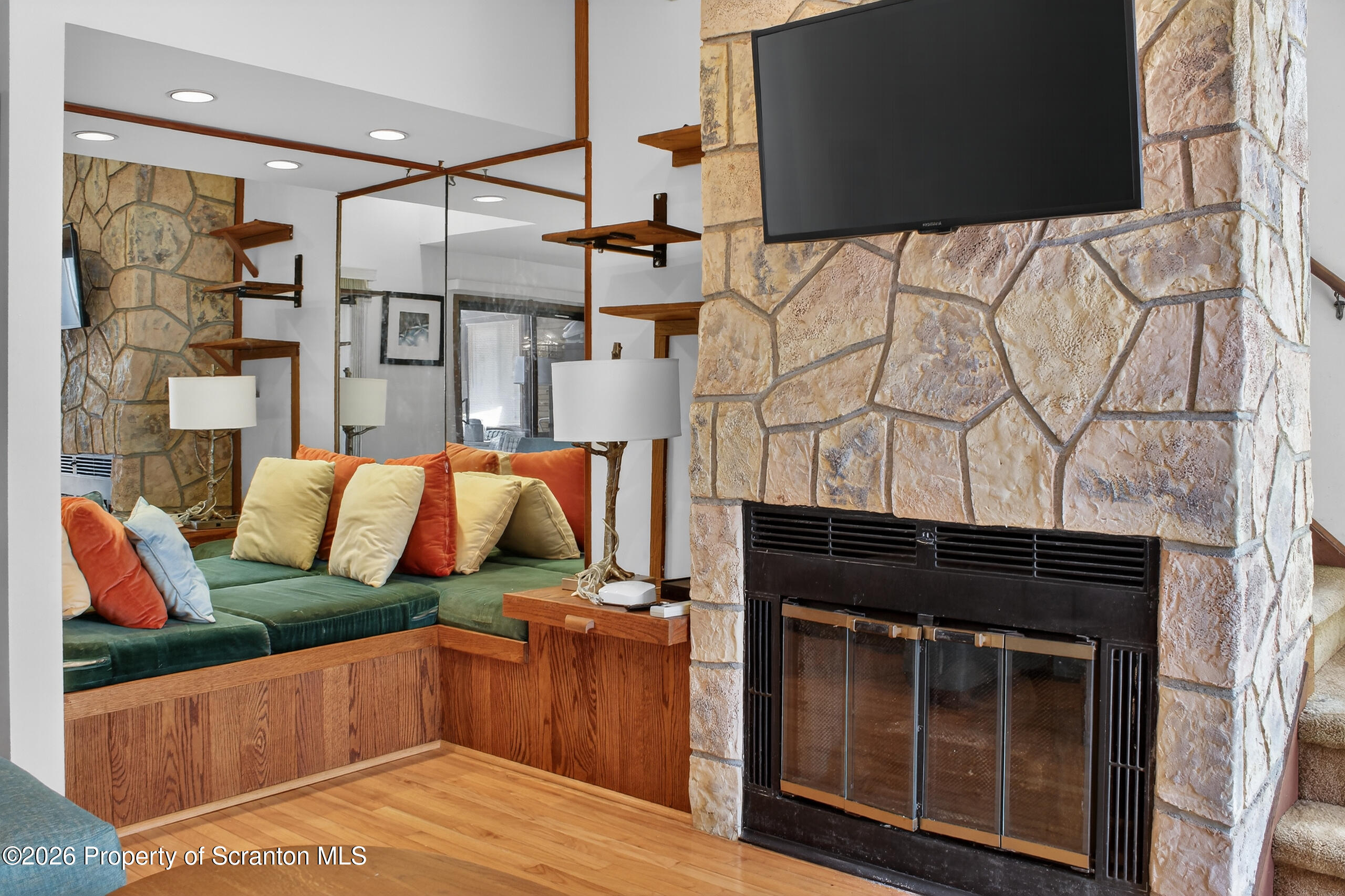211 Falls Circle Bushkill, PA 18324 - Photo 12 of 28 a living room with a couch and a fireplace