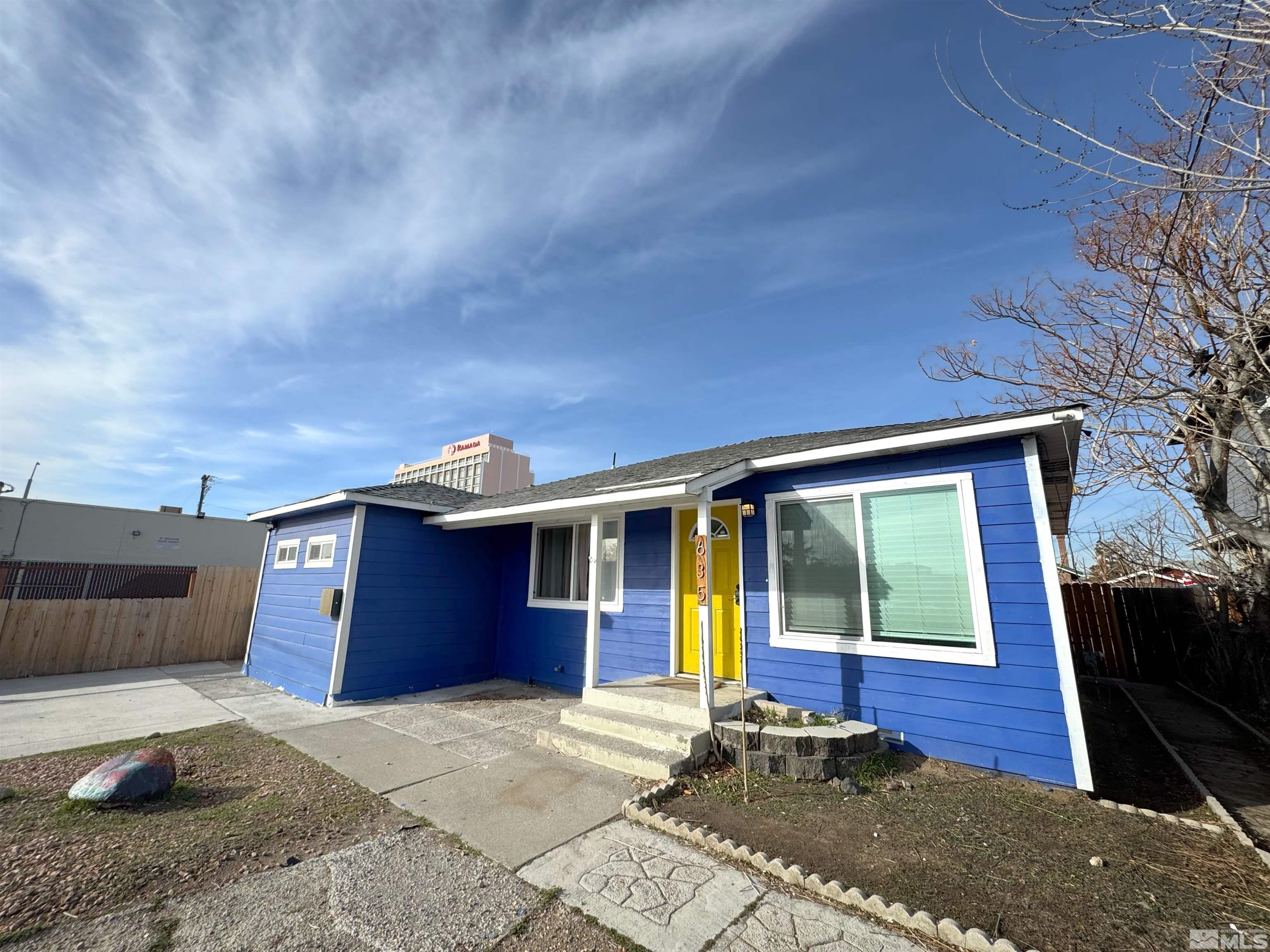 635 Sutro Street Reno, NV 89512 - Photo 1 of 17 a front view of a house with a yard