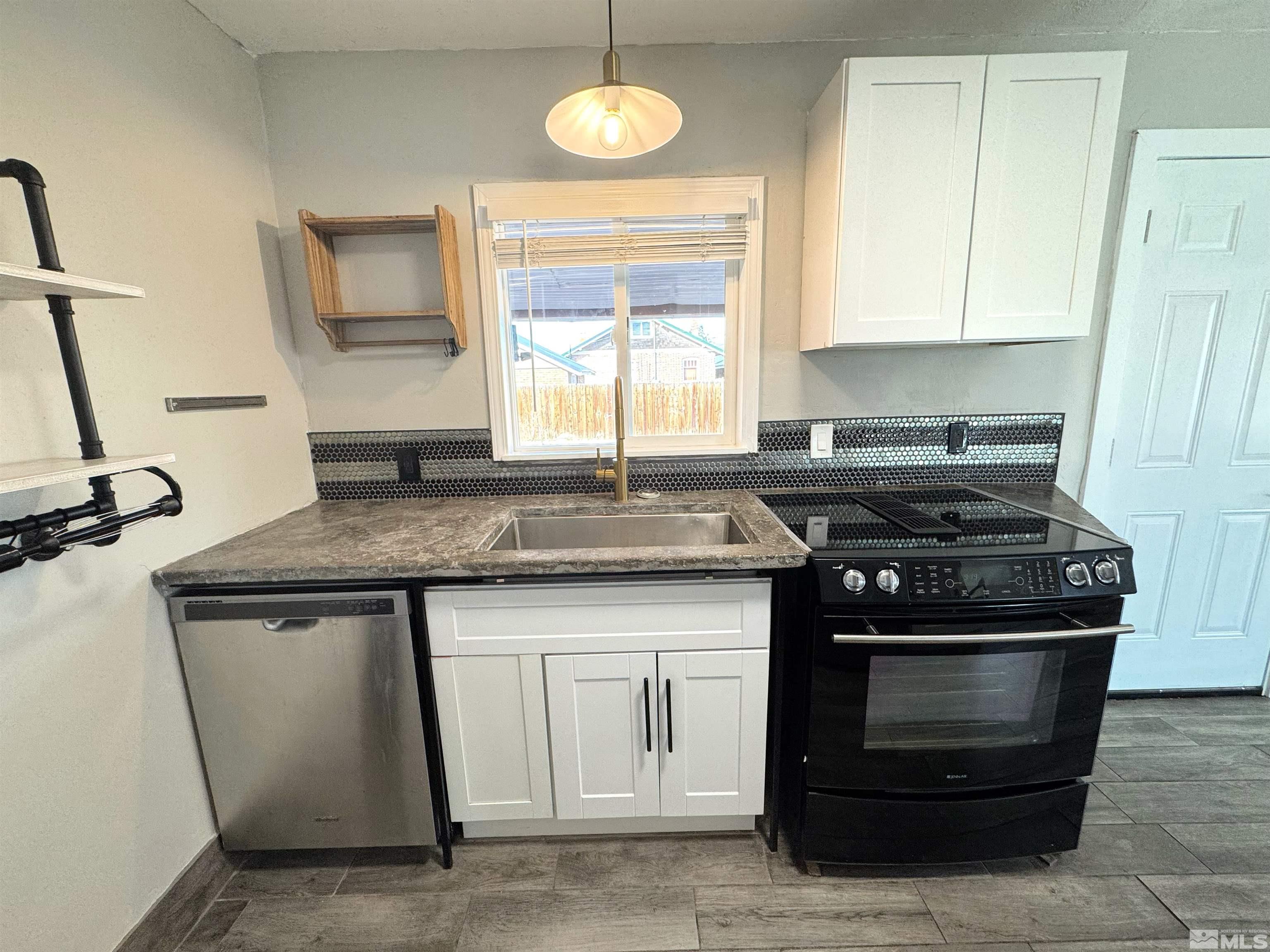 635 Sutro Street Reno, NV 89512 - Photo 5 of 17 a kitchen with a stove and a sink