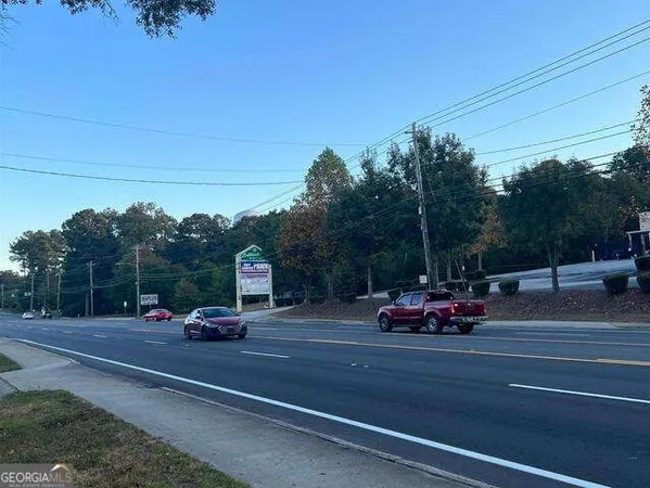 a view of street with parked cars