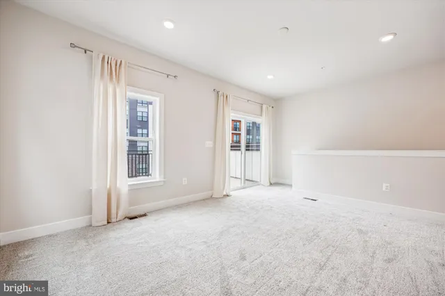 a kitchen with stainless steel appliances kitchen island granite countertop a stove and a sink