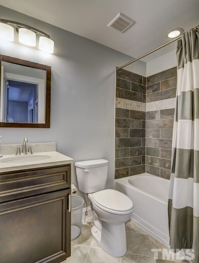 520 Alston Street Raleigh, NC 27601 - Photo 11 of 15 a bathroom with a sink a toilet and shower