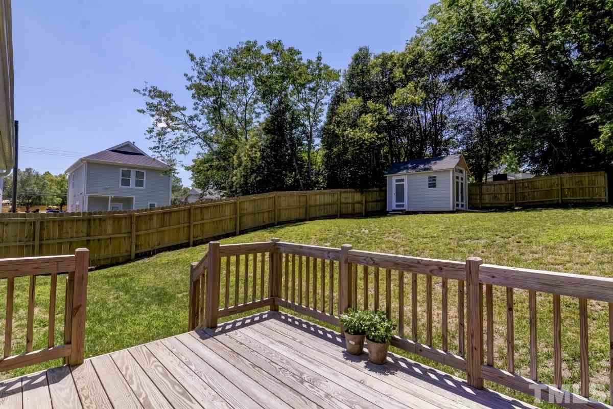 520 Alston Street Raleigh, NC 27601 - Photo 12 of 15 a view of a wooden deck and a yard with swimming pool