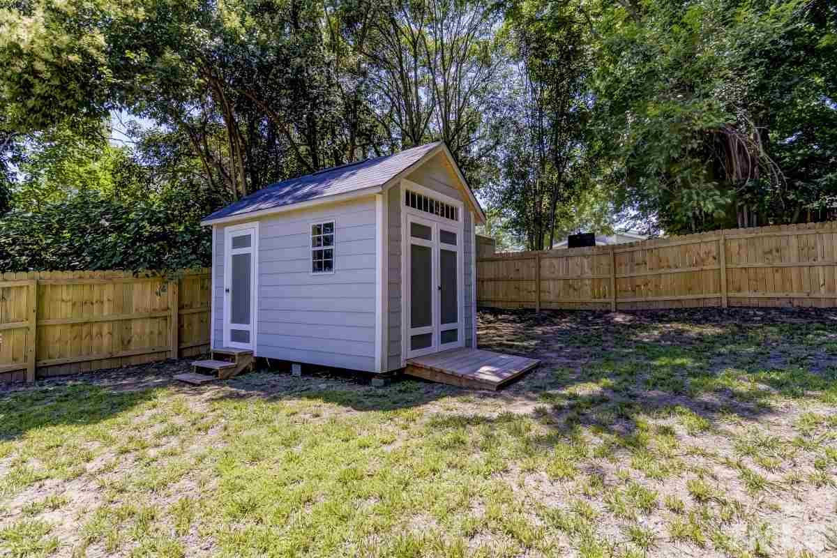 520 Alston Street Raleigh, NC 27601 - Photo 14 of 15 a view of backyard with wooden fence and large trees