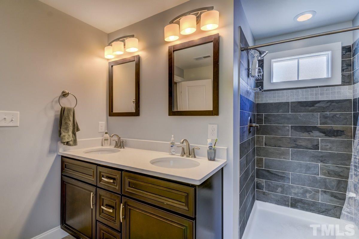 520 Alston Street Raleigh, NC 27601 - Photo 7 of 15 a bathroom with a sink and a mirror