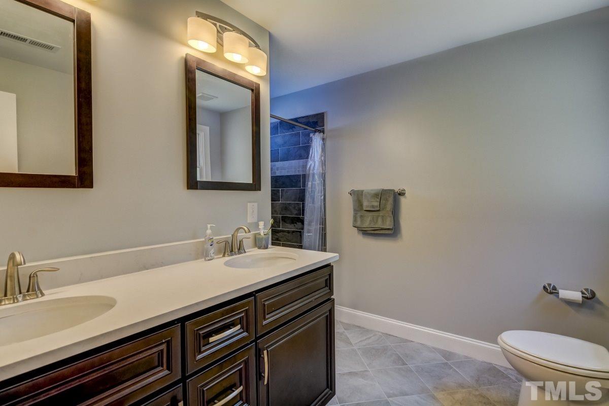 520 Alston Street Raleigh, NC 27601 - Photo 8 of 15 a bathroom with a sink and a toilet