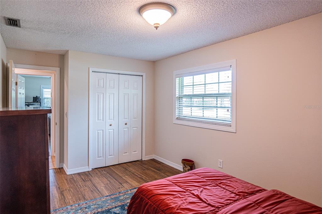 741 Brookside Road Maitland, FL 32751 - Photo 23 of 43 a bedroom with bed and a window